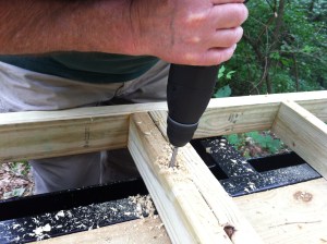 Dad drilling the first hole. 