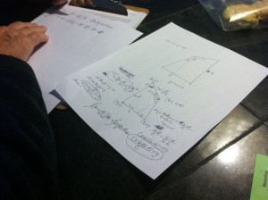 Dad hard at work on calculating the pitch and dimensions of the new roof. 